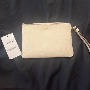 Coach white wristlet wallet in white leather with gold hardware
